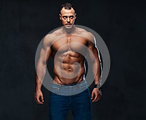 Portrait of shirtless muscular male in a jeans.