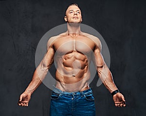 Portrait of shirtless muscular male in a jeans.