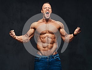 Portrait of shirtless muscular male in a jeans.