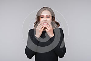 Portrait of shocked afraid woman looking with having wide open mouth gesturing palms. Half length portrait