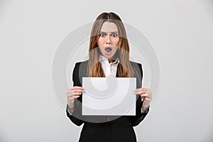 Portrait of a shocked businesswoman dressed in suit