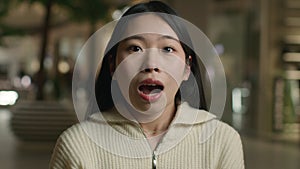 Portrait shocked confused frightened Asian woman japanese chinese korean girl astonish wonder amazed scared female with