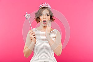 Portrait of a shocked girl wearing crown