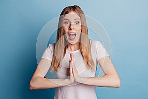 Portrait of shocked surprised lady plead open mouth wear white t-shirt isolated on blue color background