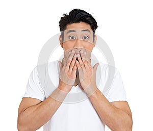 Portrait of an shocked surprised young man looking at camera