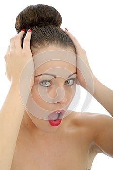 Portrait Of A Shocked And Upset Young Woman Holding Her Head In