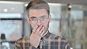 Portrait of Shocked Young Designer in Awe at Work