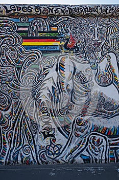 A portrait shot of abstract graffiti on East Side Gallery, Berlin Wall in Berlin, Germany