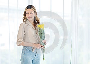Portrait shot of Asian professional successful female florist designer shop owner entrepreneur businesswoman in apron standing