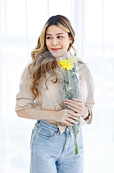 Portrait shot of Asian professional successful female florist designer shop owner entrepreneur businesswoman in apron standing