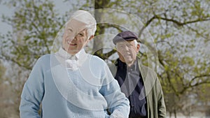 Portrait shot of happy senior couple spending time in park