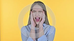 Portrait of Shouting Young Woman Screaming Loud, Yellow Background