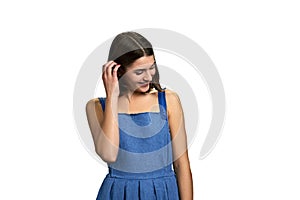 Portrait of shy girl on white background.