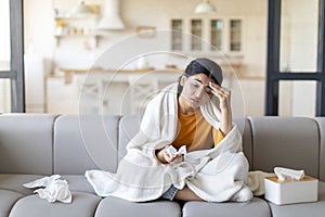 Portrait Of Sick Young Indian Woman Feeling Unwell At Home