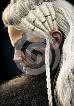 Portrait side view of a fierce viking female warrior with white braided hair and black face paint markings.