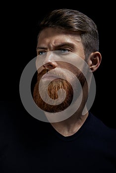 Portrait of single bearded handsome young caucasian man