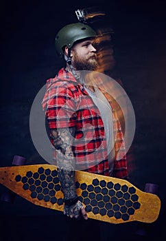 Portrait of skateboarded with go pro on his helmet. photo