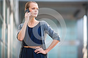 Portrait of a sleek young woman calling on a smartphone