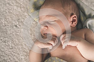 Portrait of sleeping newborn baby close up