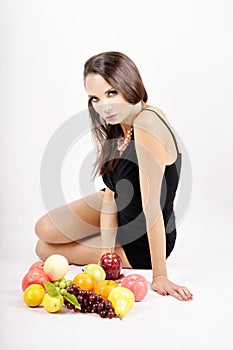 Portrait of slim fitness cheerful girl lying in studio with set