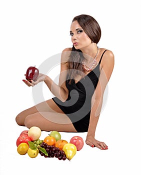 Portrait of slim fitness cheerful girl in studio with set of fruit and vegetables over white background. Healthy eating, diet, fit