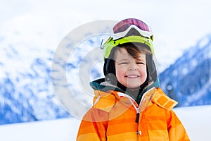 Portrait of small boy in ski mask and helmet