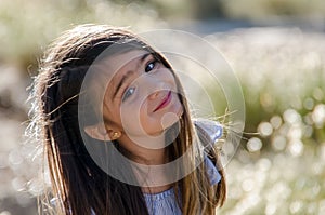 Portrait of small girl with long brown hair