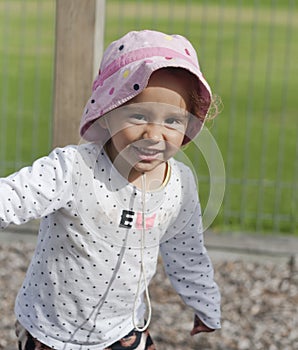 Portrait of a small laughing girl