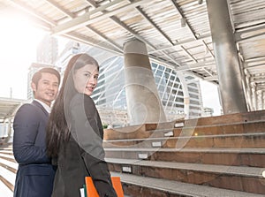 Portrait of smart confident business man boss and colleague business woman looking and smiling at camera,