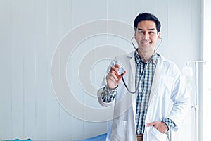 Portrait of a smart doctor standing in the medical room wait for diagnosing patient and treatment in new concept modern medicine