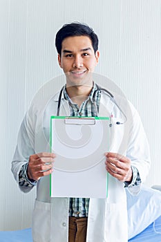 Portrait of a smart doctor standing in the medical room wait for diagnosing patient and treatment in new concept modern medicine