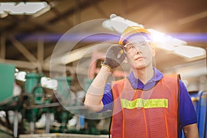 Portrait of smart engineer Asian Chinese happy labor worker handsome model in heavy industry  background.hand at protection