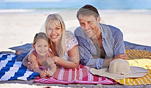 Portrait, smile and beach with family, holiday and summer with weekend break and getaway trip. Face, parents and mother