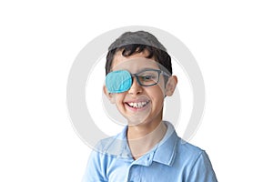 Portrait of smile boy in glasses with patch. Eye patch for glasses t treat lazy eye, amblyopia, strabismus.