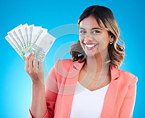 Portrait, smile and business woman with euros in studio isolated on a blue background. Financial winner, face and happy