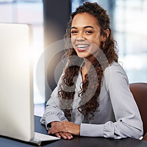 Portrait, smile and business woman in office by computer for career, job or working at startup company. Face, happy