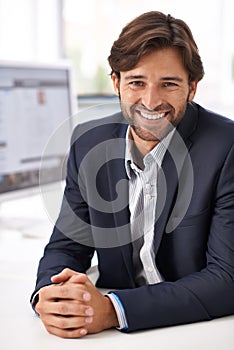 Portrait, smile and businessman at tech startup with computer, website and small business online. Professional, ux