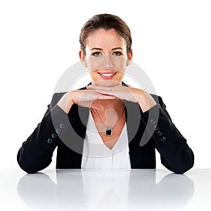 Portrait, smile and confident business woman at table in studio isolated on a white background. Face, happy professional
