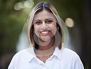 Portrait, smile and confident with a woman in nature, outdoor on a green background for travel or freedom. Face, happy