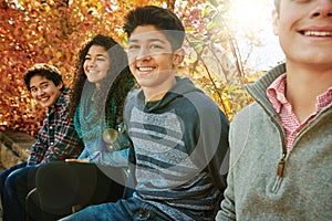Portrait, smile and gen z with autumn, park and nature for college break and bonding. Group, forest and diversity with