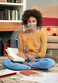 Portrait, smile and happy student in home library, floor and studying for exam. Education, test and learning for