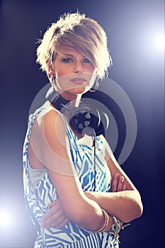 Portrait, smile and headphones with woman, arms crossed and dj with mixes, online sound and audio track. Face, person or