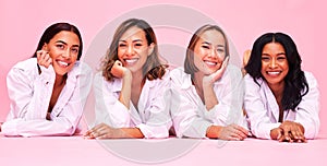 Portrait, smile and lingerie with woman friends on a pink background in studio for natural skincare. Diversity, beauty