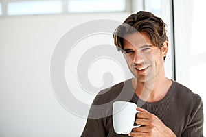 Portrait, smile and man with coffee in home for breakfast, warm beverage or relax in morning with mockup space. Happy