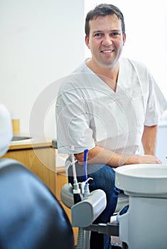 Portrait, smile or man dentist in consulting office for help, advice or mouth wellness exam. Dental, oral care or