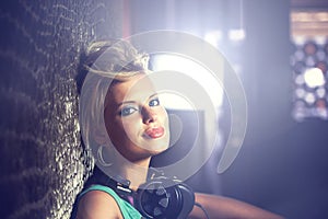 Portrait, smile and relax with woman, headphones and dj with mixes, online sound and audio track. Face, person and girl
