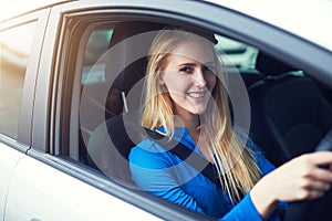 Portrait, smile and woman driving car for travel, journey and transportation. Face, happy and female person in vehicle