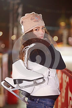 Portrait, smile and woman with ice skate, winter and happiness with fitness, training and sports. Face, female person