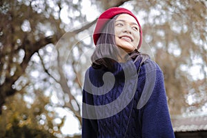 Portrait smile young girl in autumn on nature background