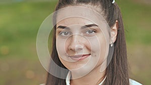 Portrait of a smiling 16 year old girl. Face close up.